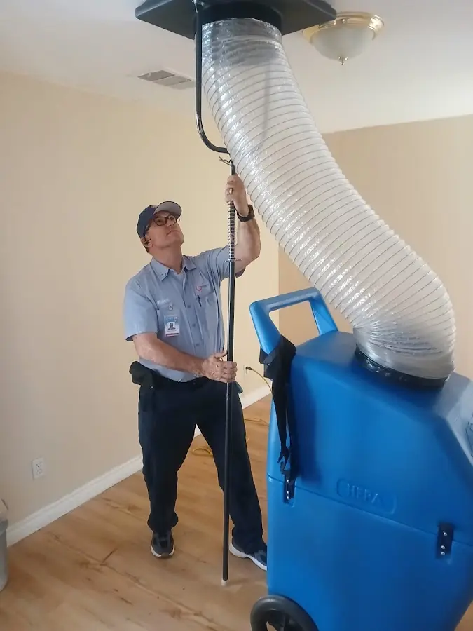 Furnace Tune-Up technician using HEPA equipment in Colorado Springs